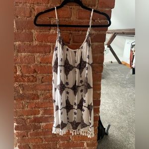 slip dress with tassel bottom